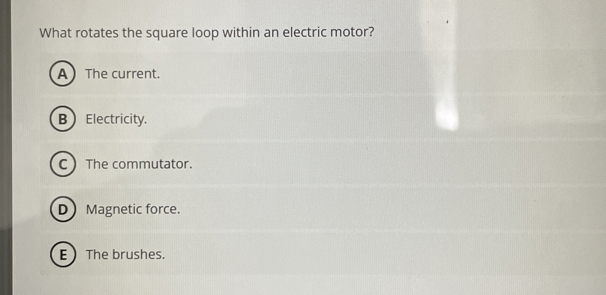 What rotates the square loop within an electric