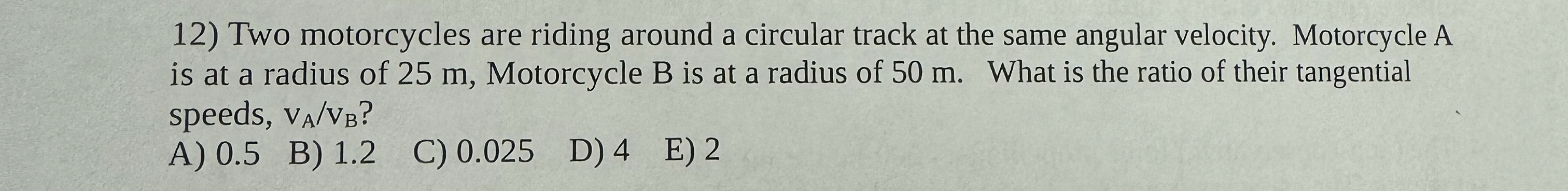 Two motorcycles are riding around a circular