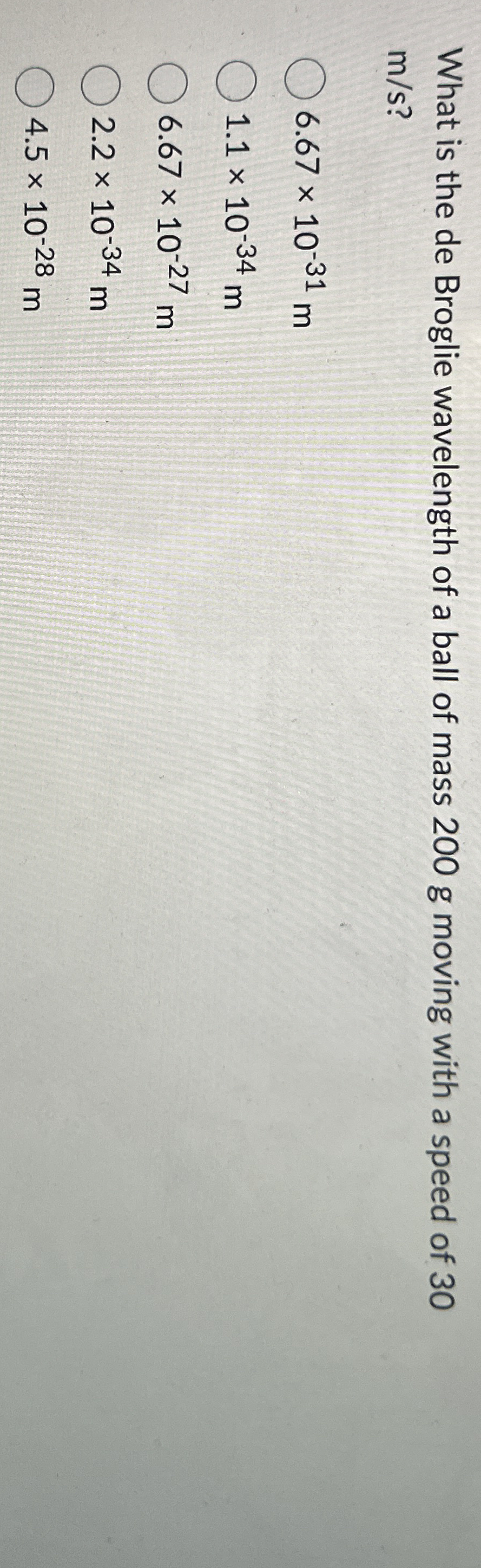 What is the de Broglie wavelength of a ball of