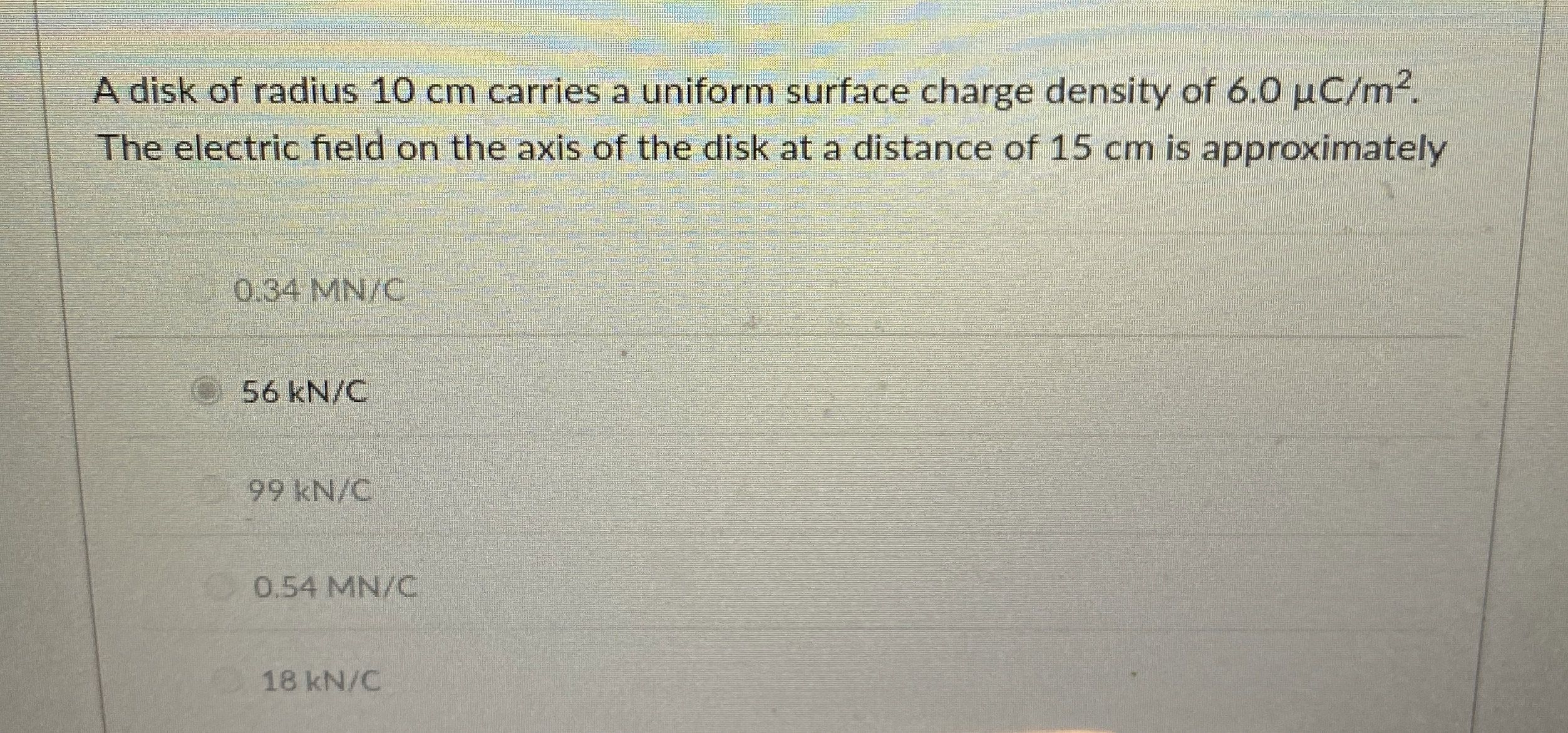 A disk of radius 1 0 cm carries a uniform surface