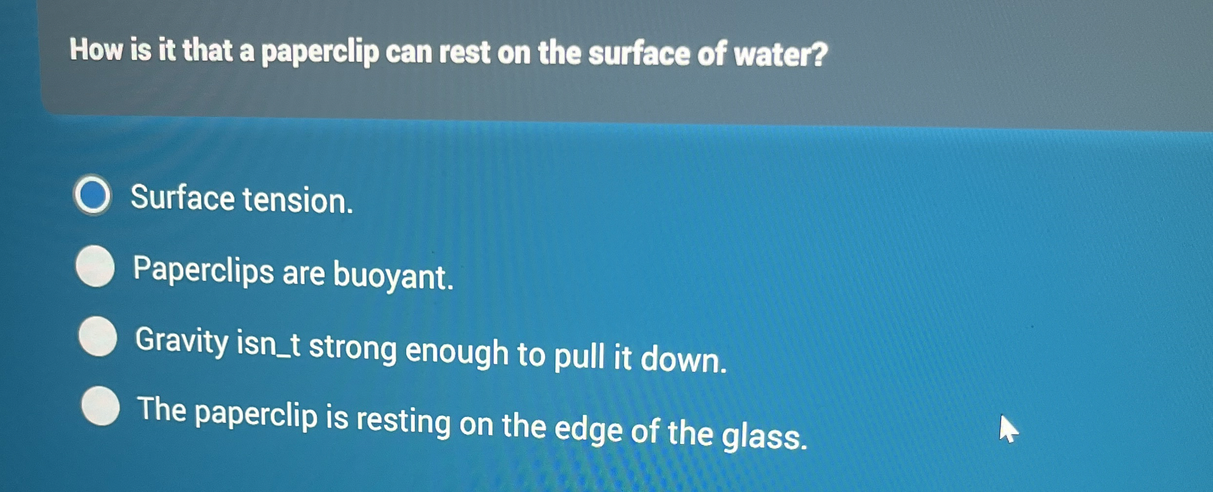 How is it that a paperclip can rest on the