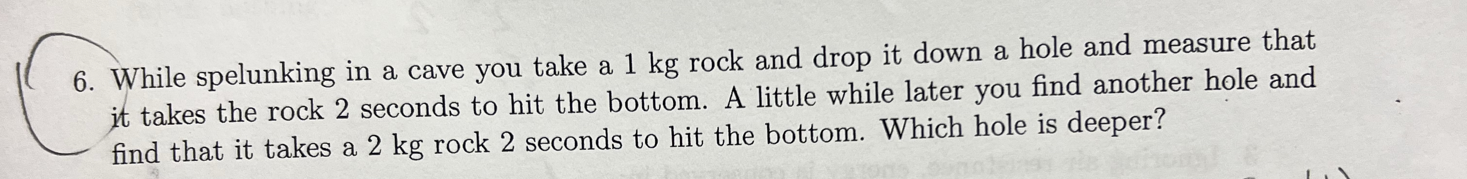 While spelunking in a cave you take a 1 kg rock