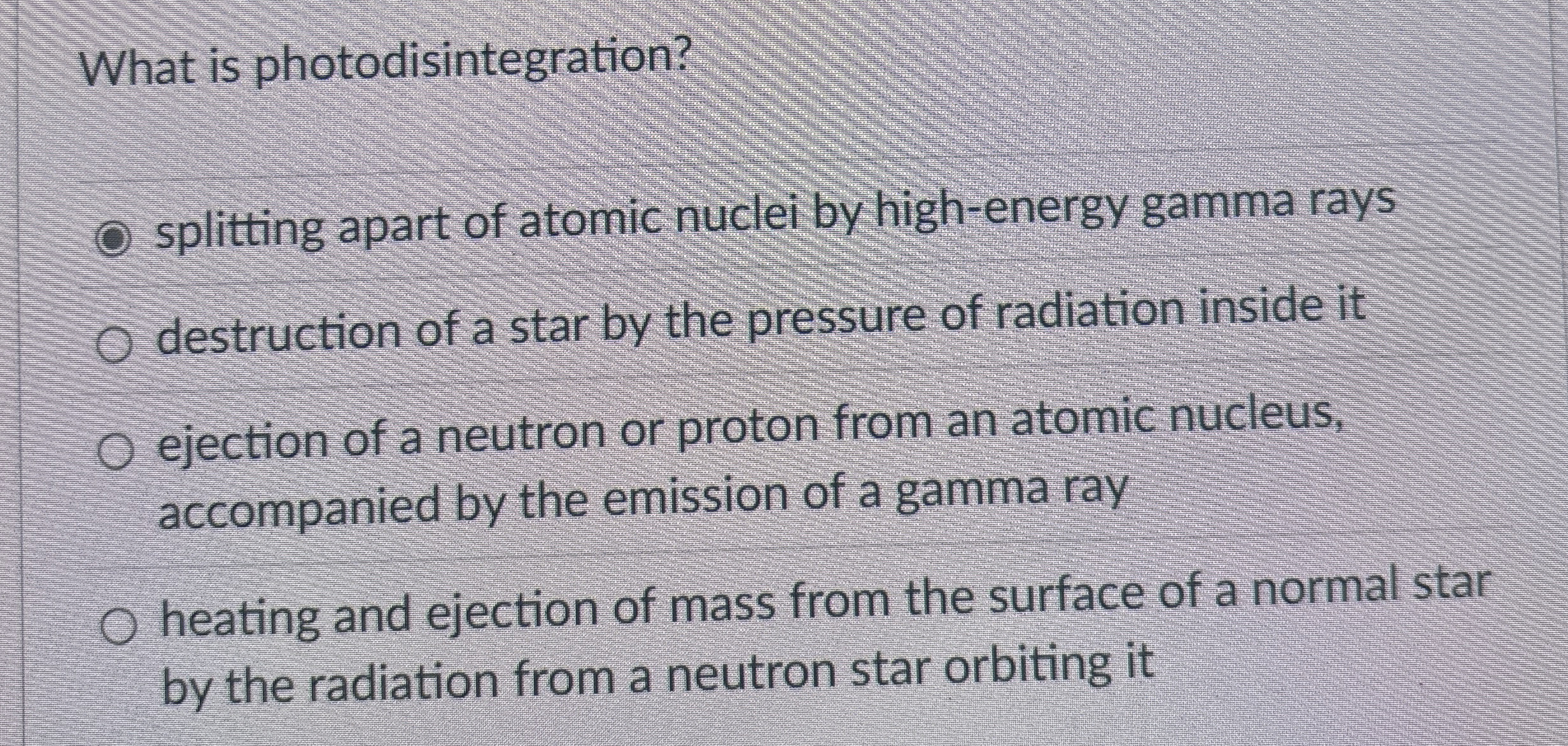 What is photodisintegration? splitting apart of