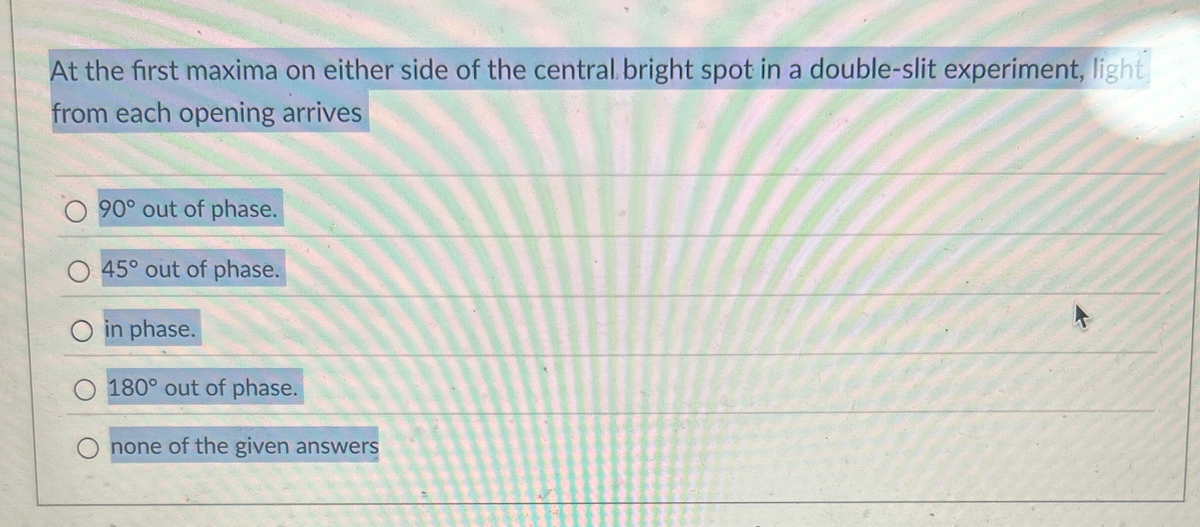At the first maxima on either side of the central