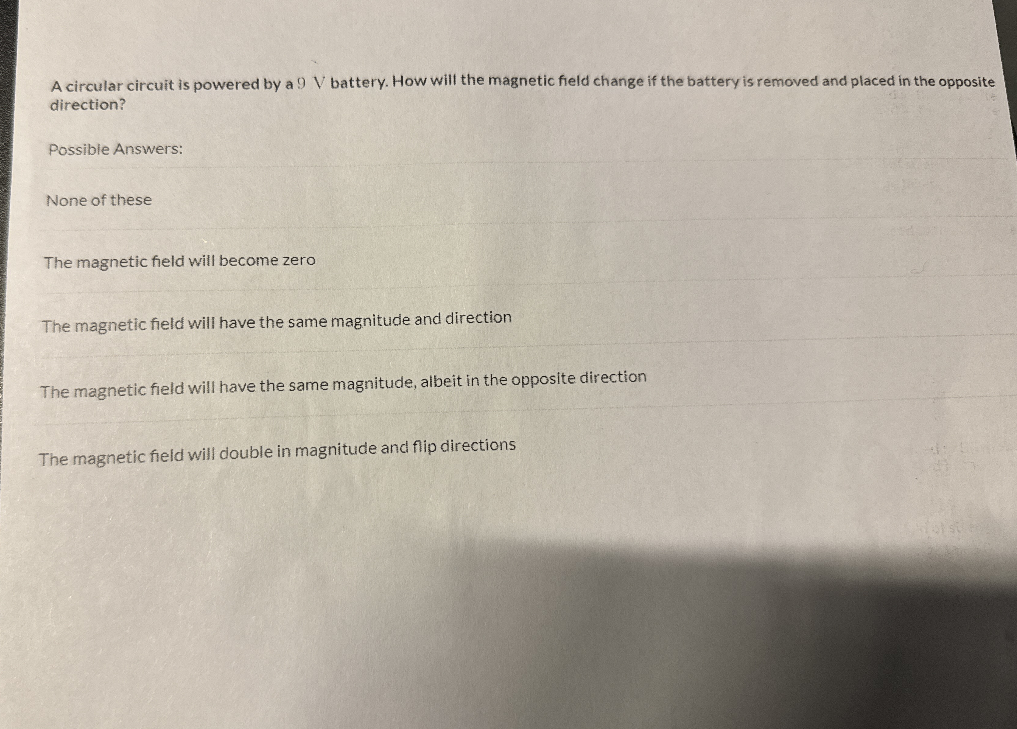 A circular circuit is powered by a 9 V battery.