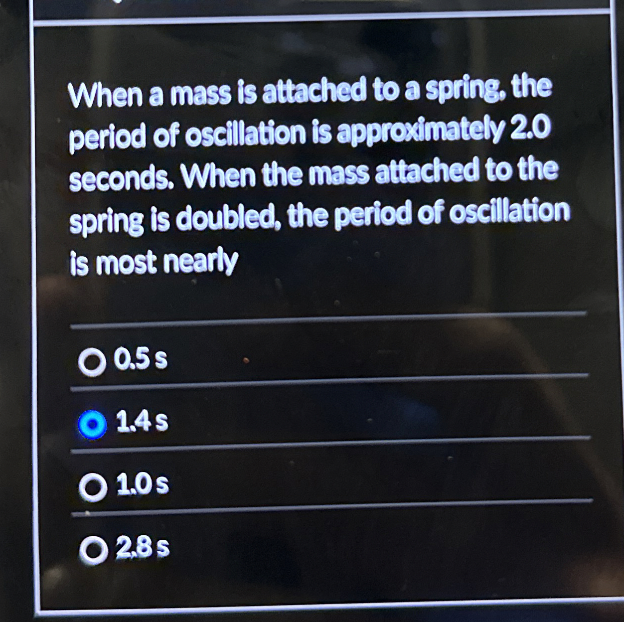 When a mass is attached to a spring, the period