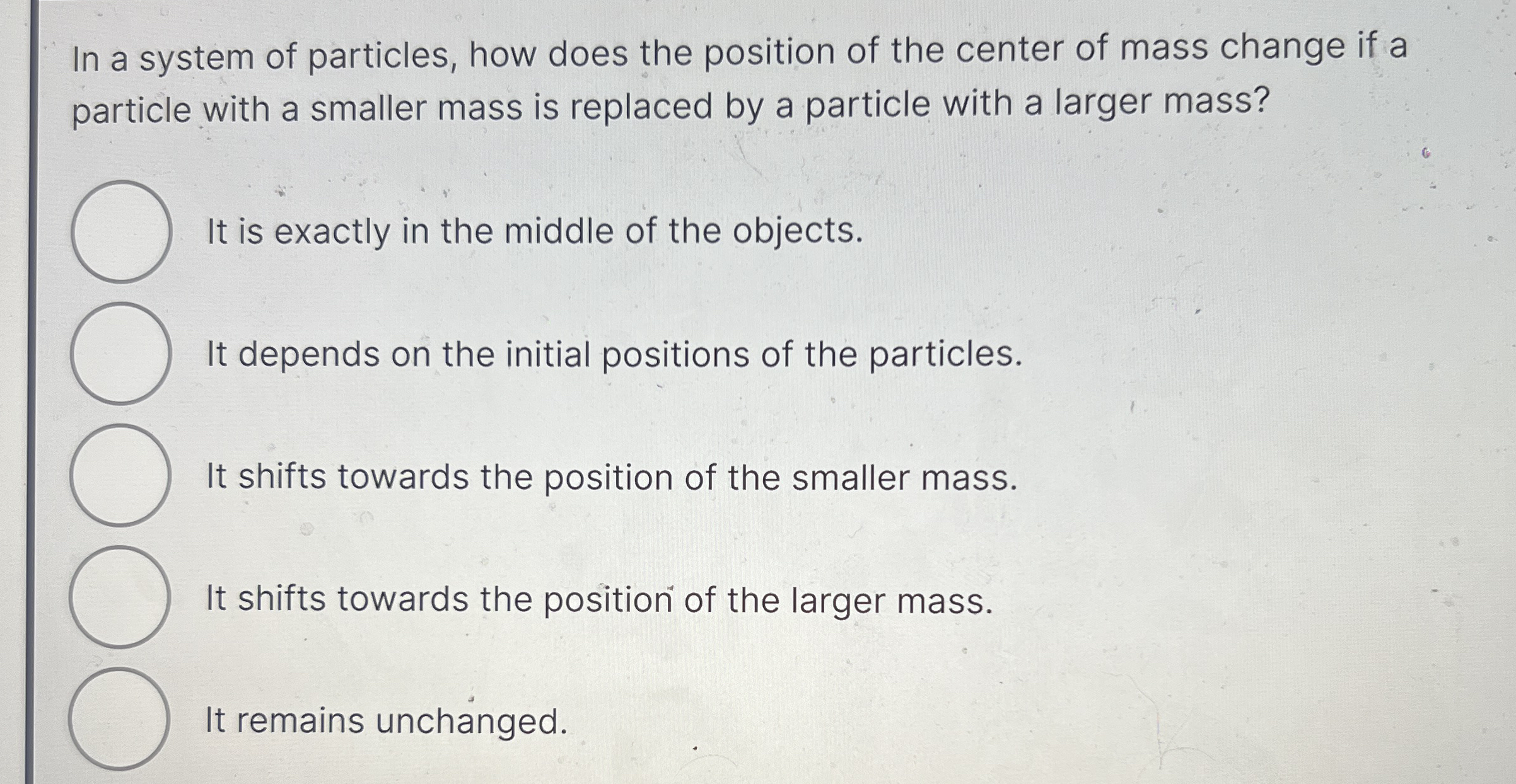 In a system of particles, how does the position