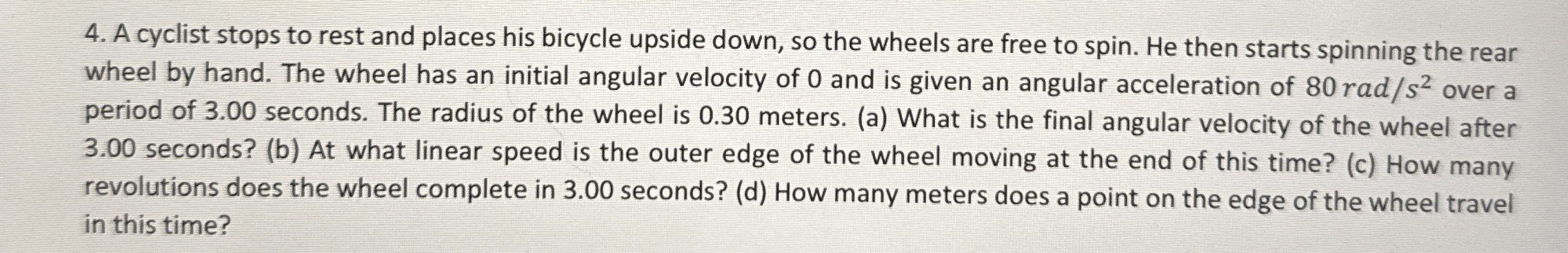 A cyclist stops to rest and places his bicycle