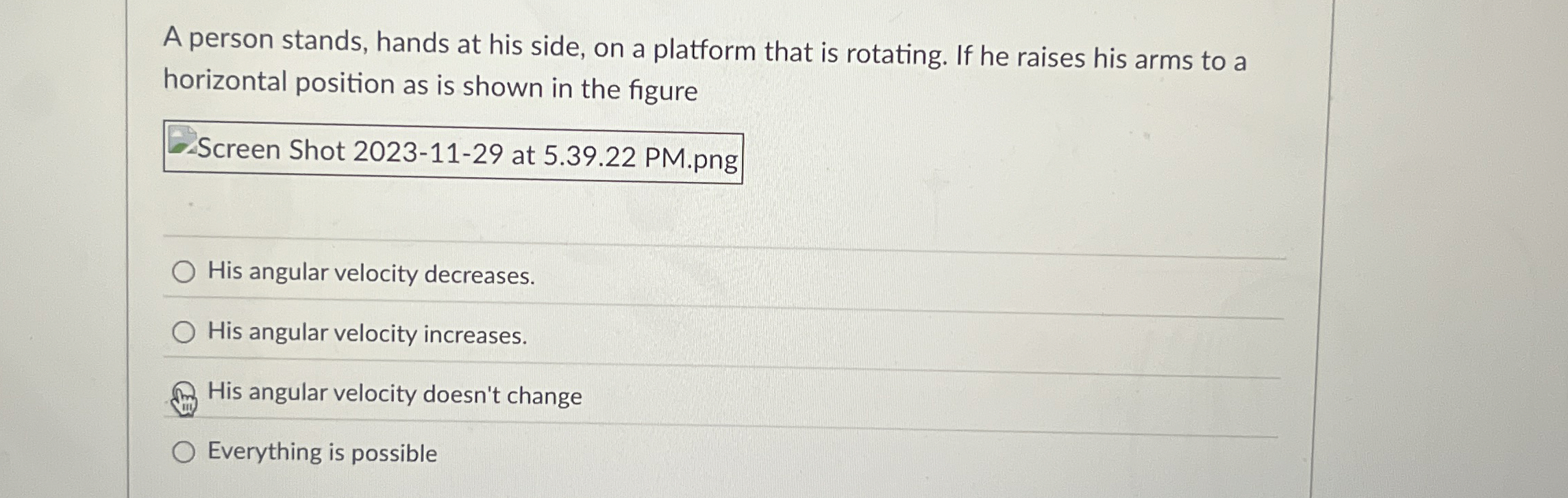 A person stands, hands at his side, on a platform