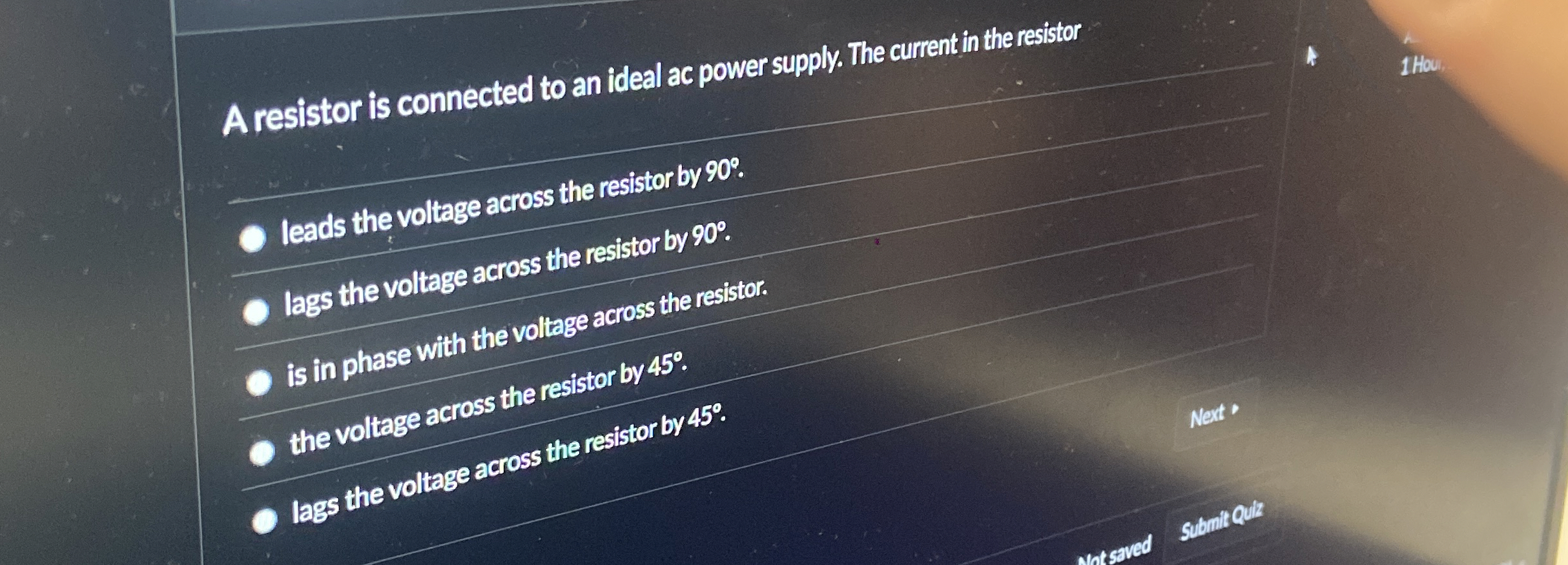 A resistor is connected to an ideal ac power