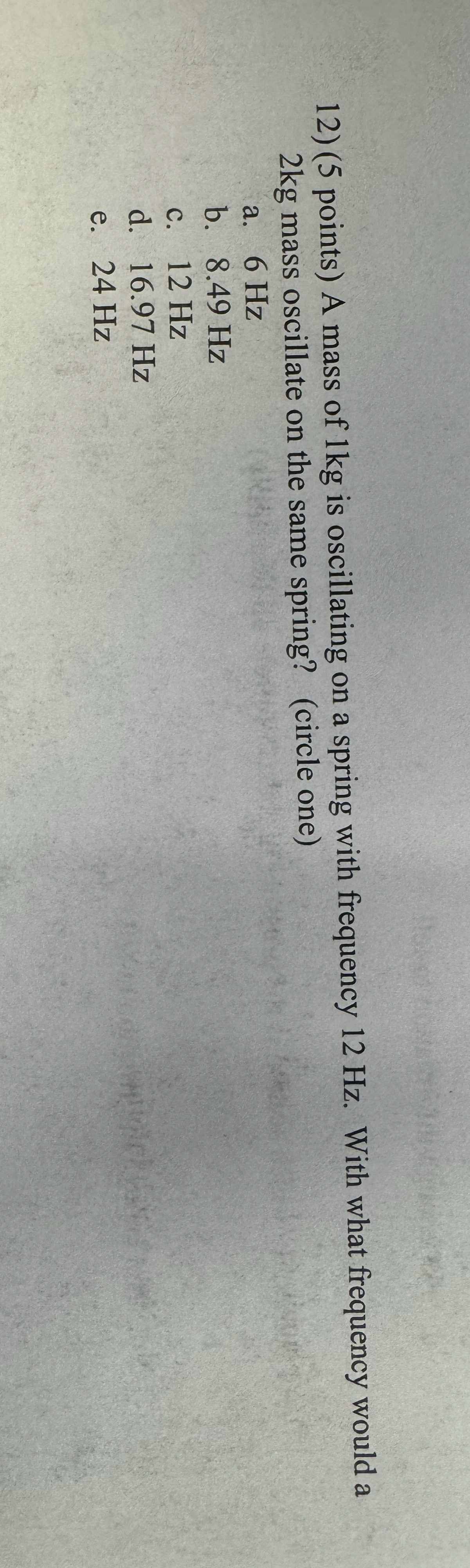 ( 5 points ) A mass of 1 kg is oscillating on a