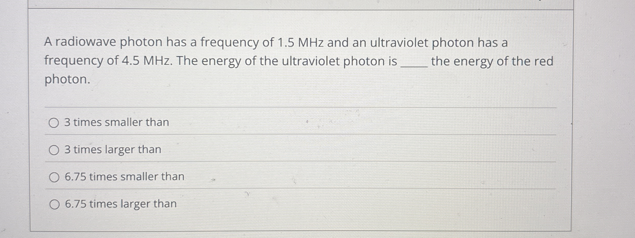 A radiowave photon has a frequency of 1 . 5 MHz