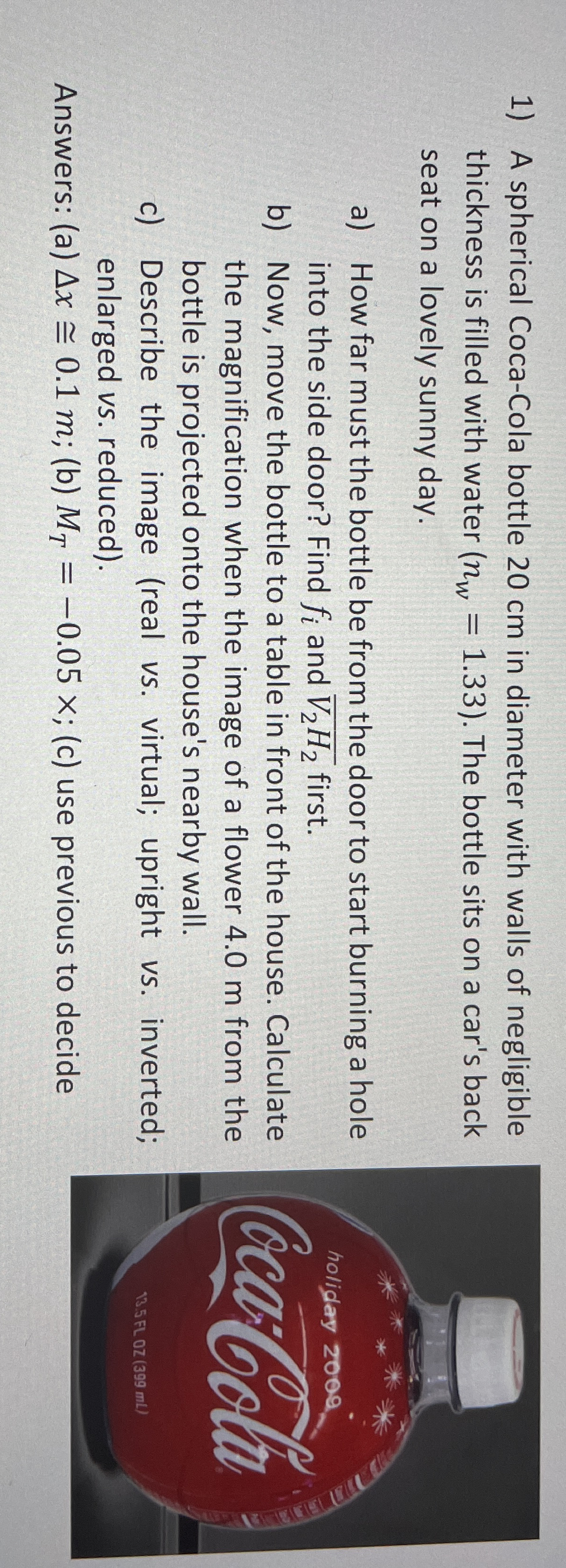 A spherical Coca - Cola bottle 2 0 cm in diameter