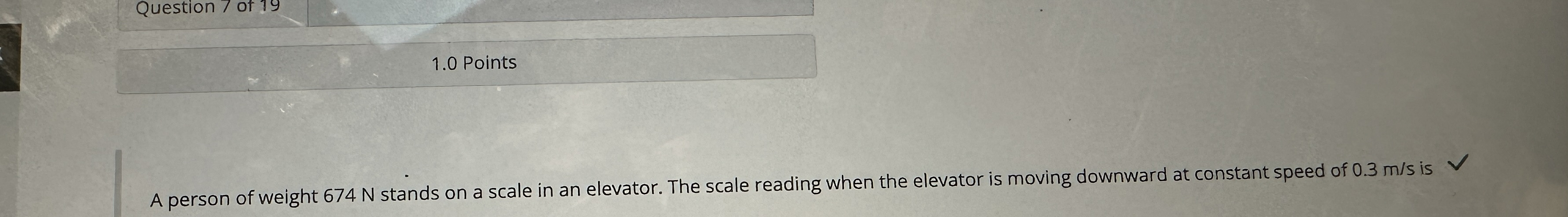 A person of weight 6 7 4 N stands on a scale in