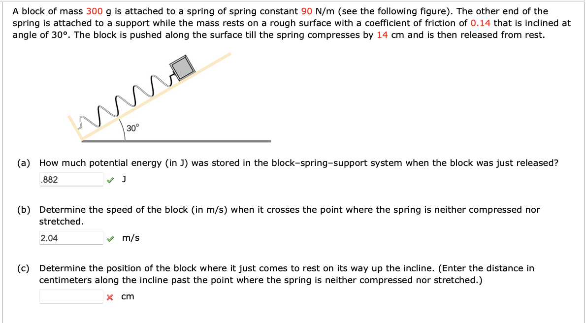 A block of mass 3 0 0 g is attached to a spring