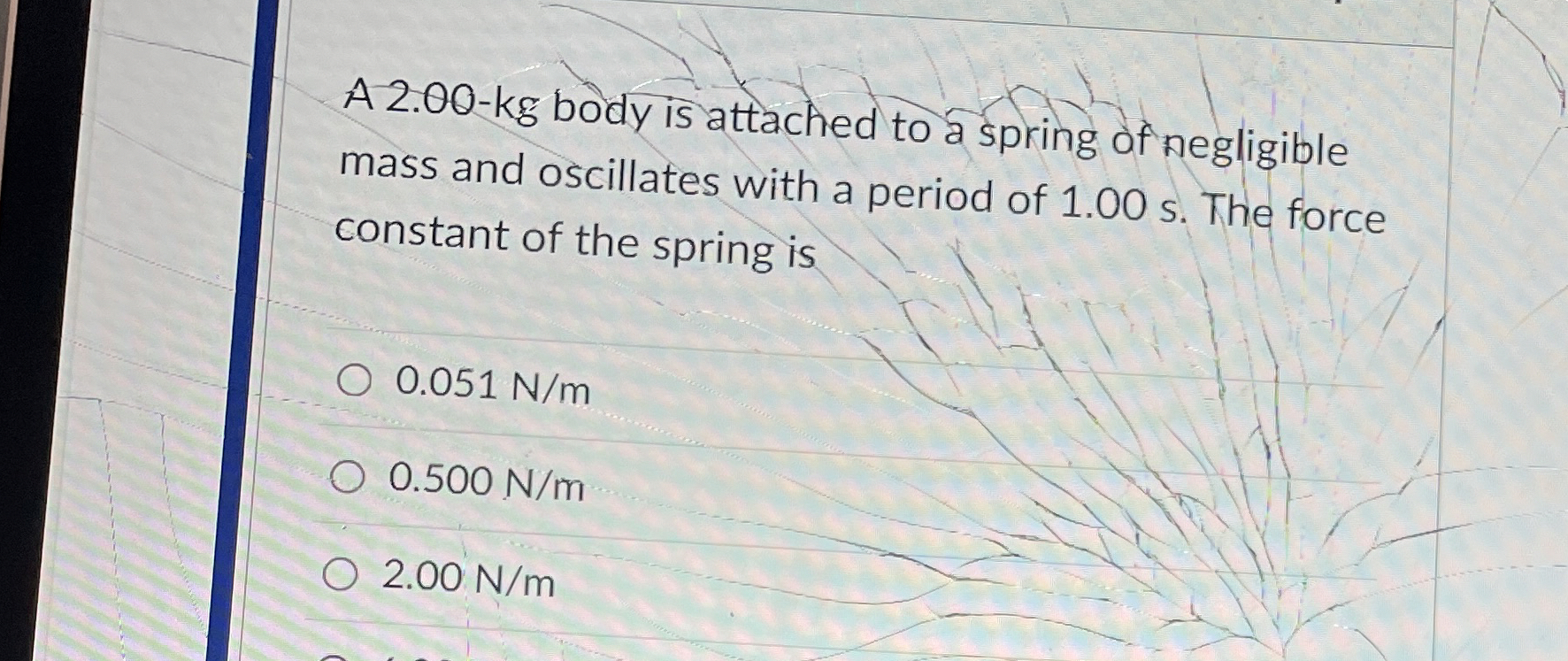 A 2 . 0 0 - k g body is attached to a spring of