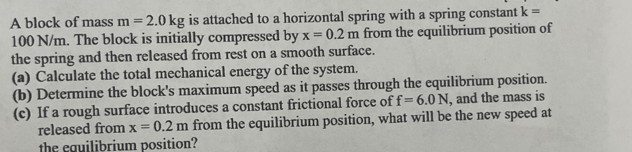 A block of mass m = 2 . 0 k g is attached to a