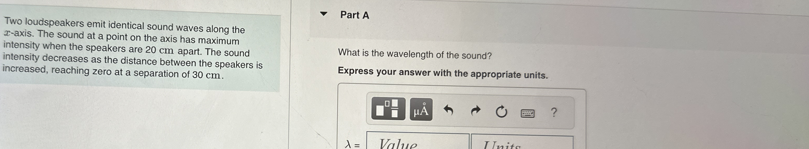 Two loudspeakers emit identical sound waves along