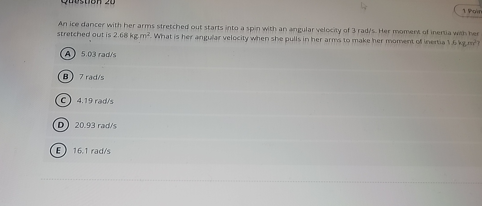 An ice dancer with her arms stretched out starts