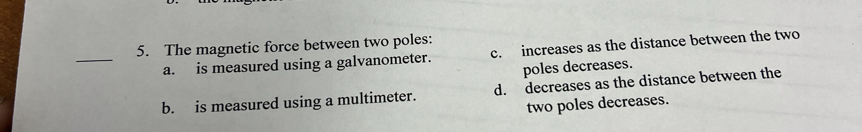 The magnetic force between two poles: a . is