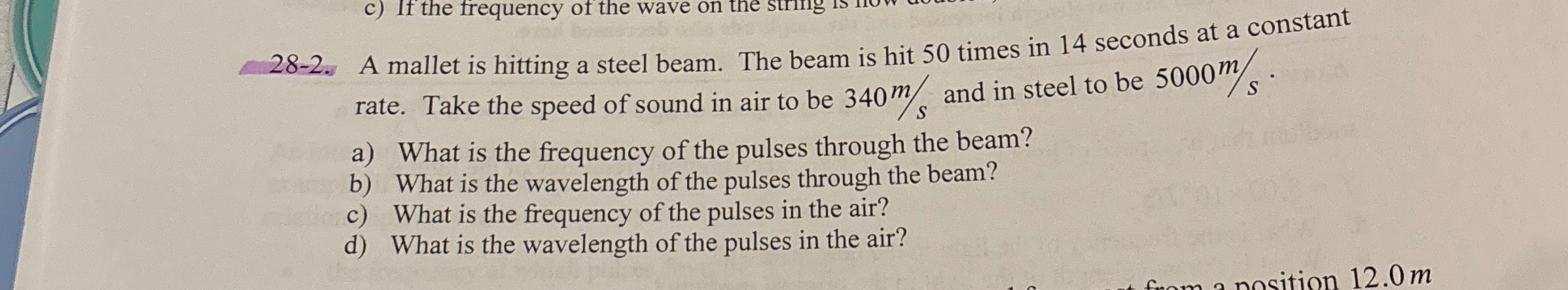 2 8 - 2 . A mallet is hitting a steel beam. The