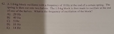 A 1 . 0 - k g block oscillates with a frequency