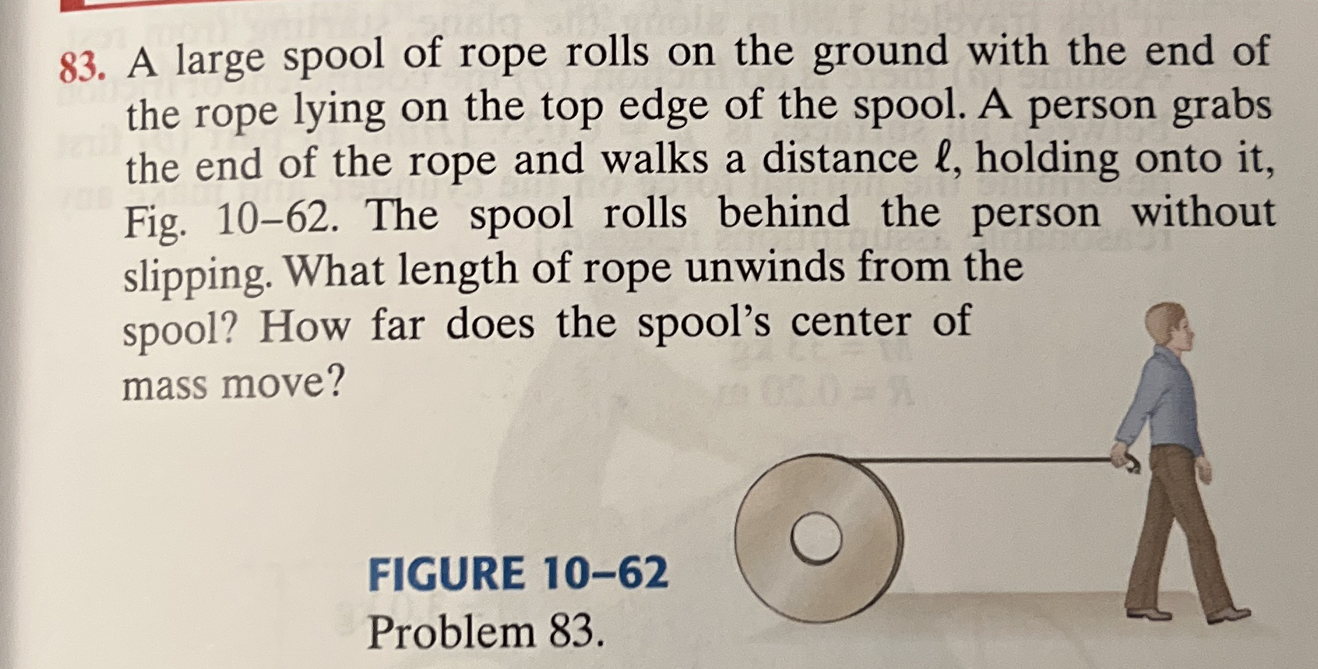 A large spool of rope rolls on the ground with