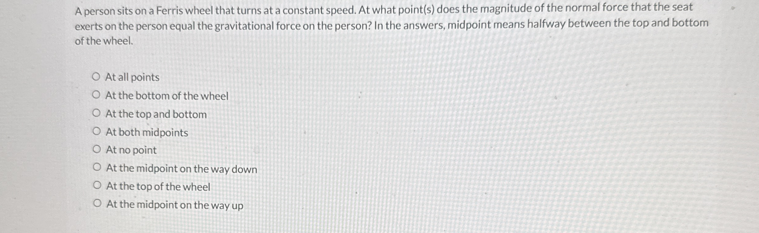 A person sits on a Ferris wheel that turns at a