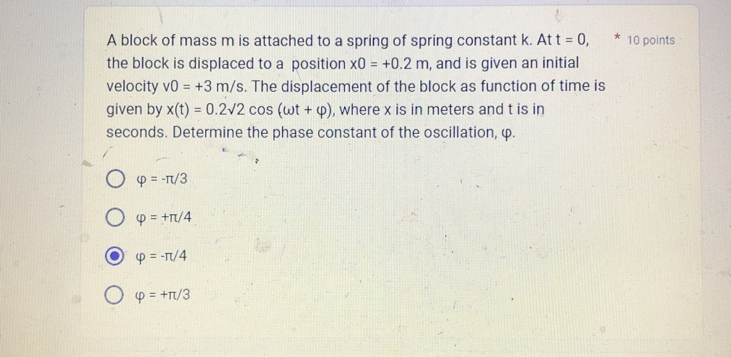 A block of mass m is attached to a spring of