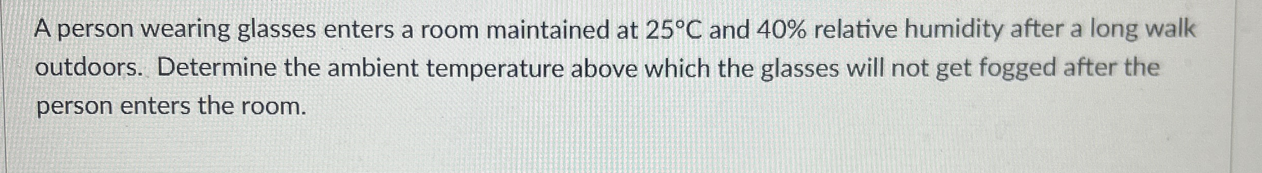 A person wearing glasses enters a room maintained