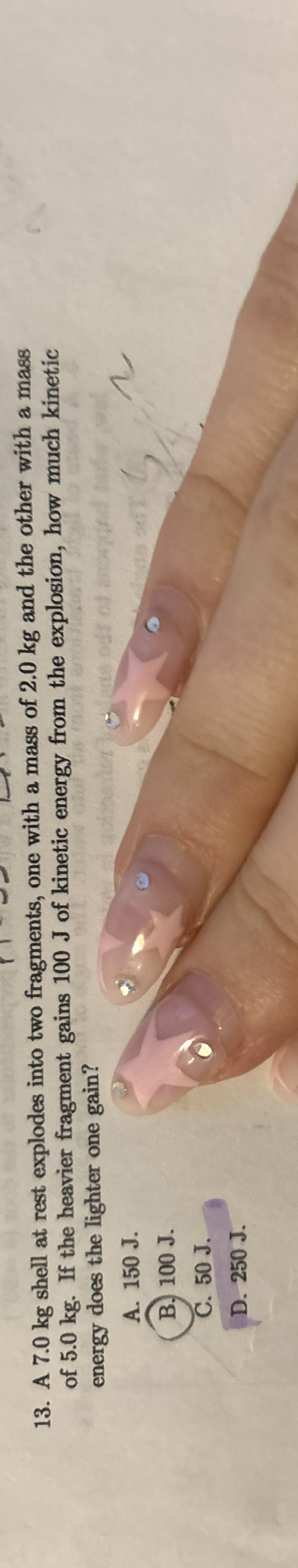 A 7 . 0 kg shell at rest explodes into two