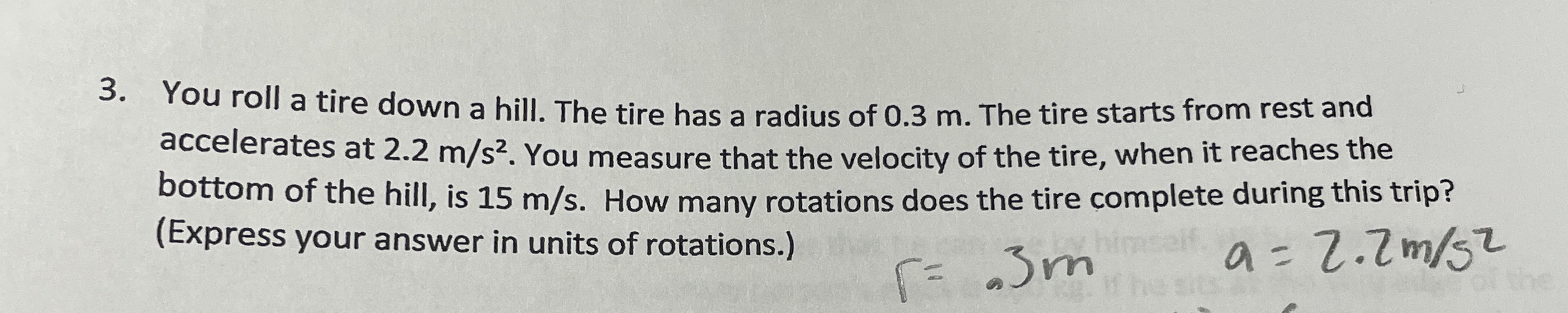 You roll a tire down a hill. The tire has a