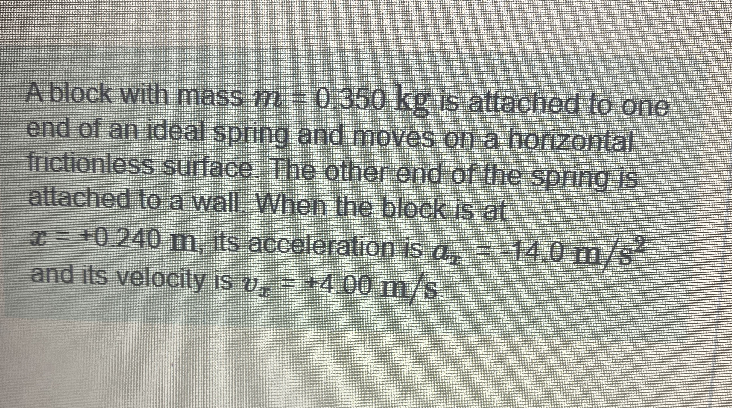 A block with mass m = 0 . 3 5 0 k g is attached