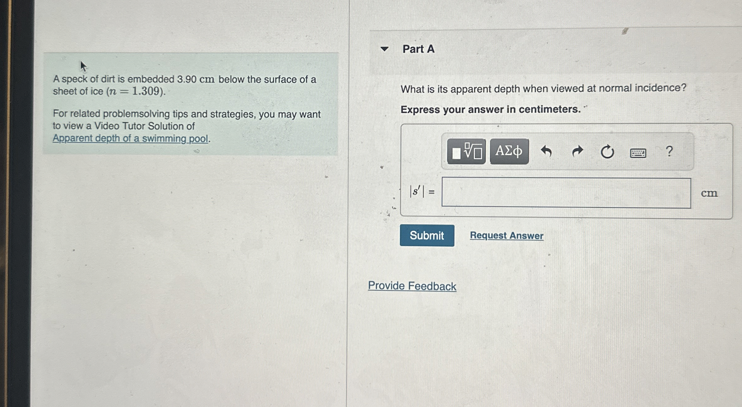 A speck of dirt is embedded 3 . 9 0 cm below the