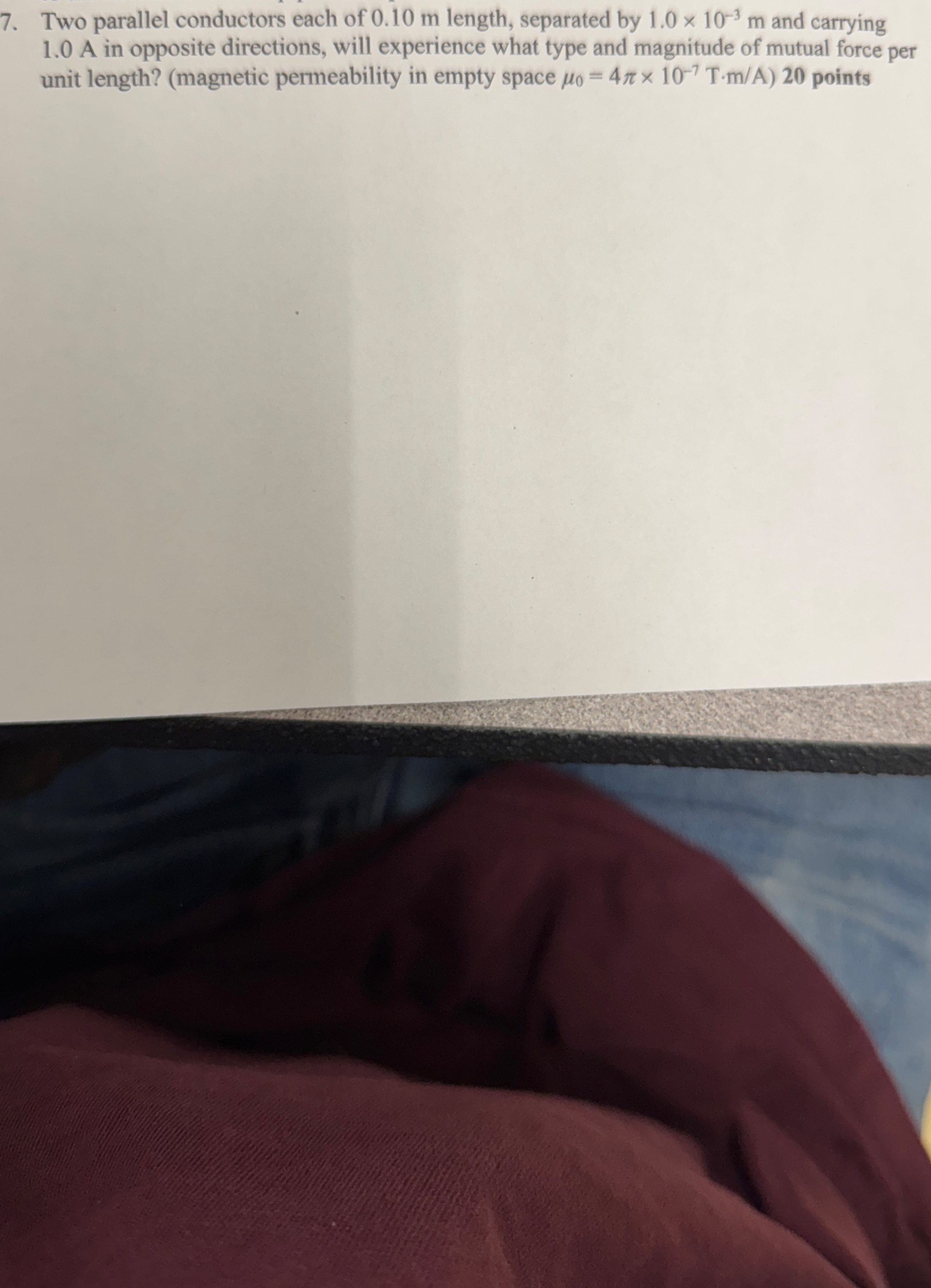 Two parallel conductors each of 0 . 1 0 m length,