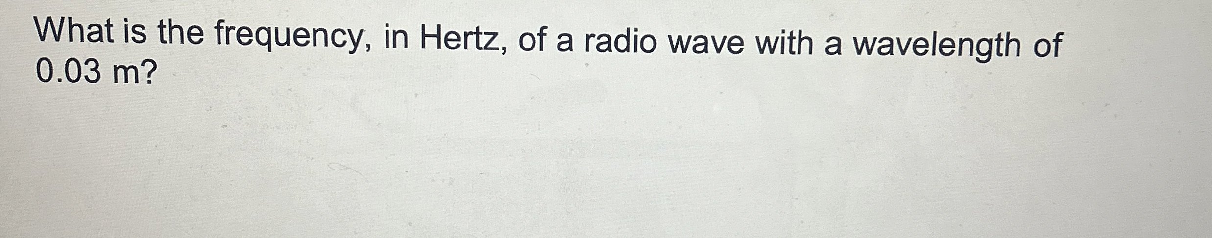 What is the frequency, in Hertz, of a radio wave