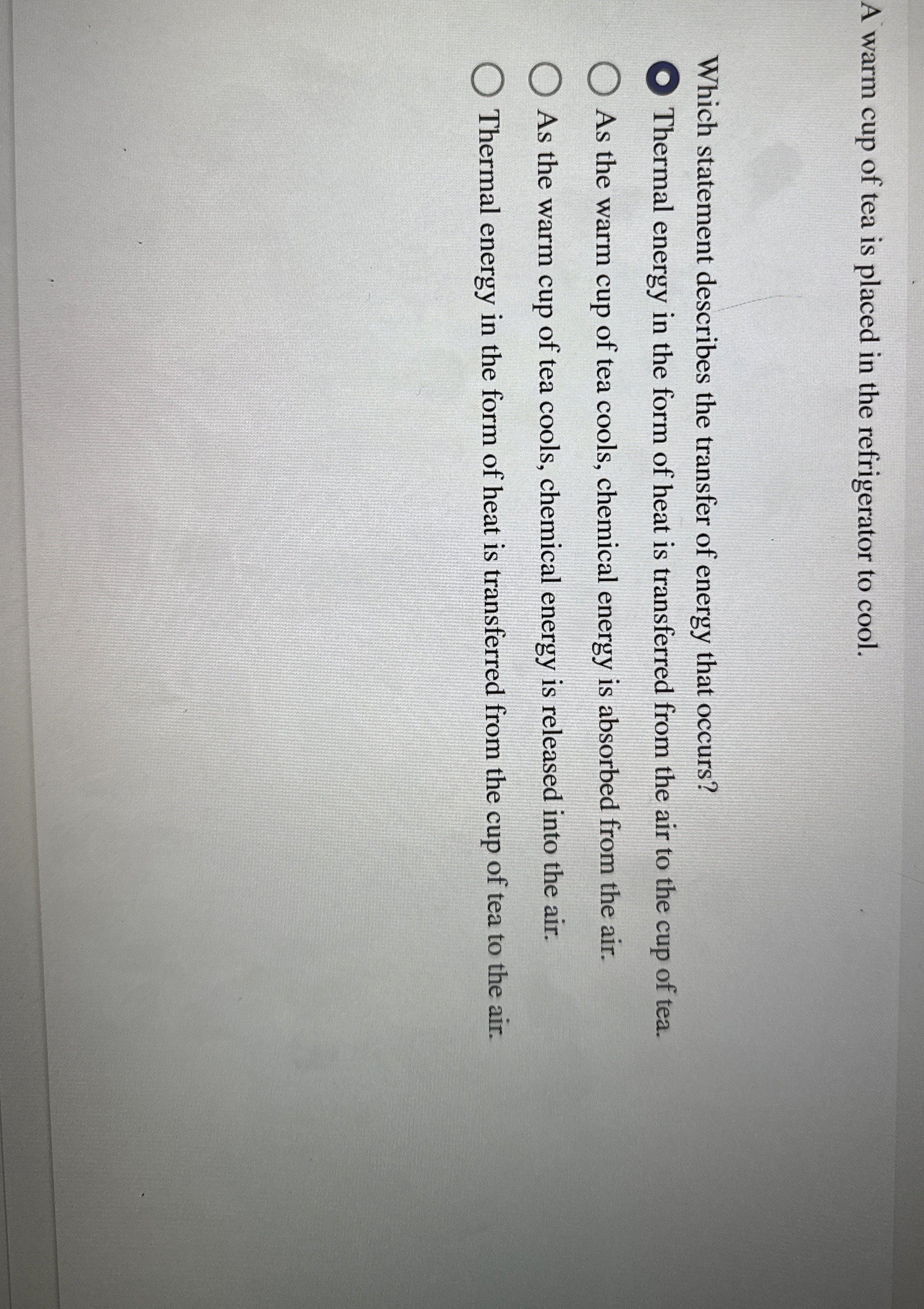 A warm cup of tea is placed in the refrigerator