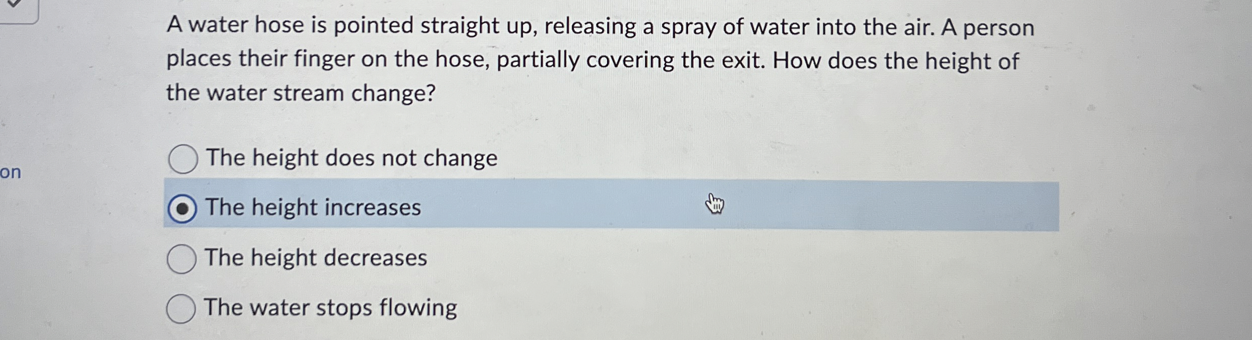 A water hose is pointed straight up , releasing a