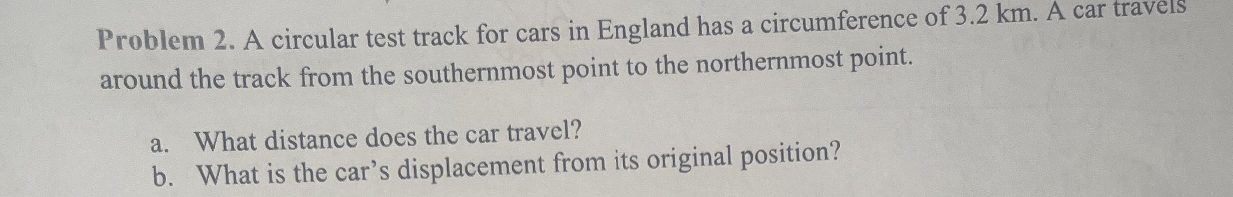 Problem 2 . A circular test track for cars in