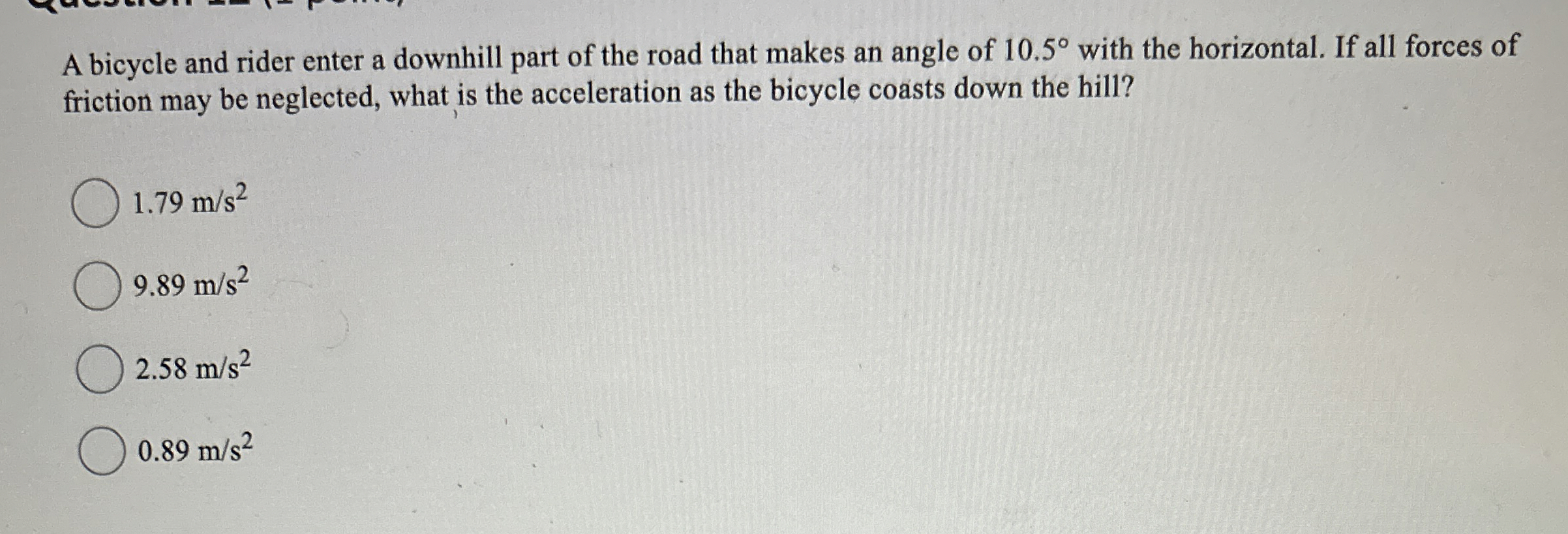 A bicycle and rider enter a downhill part of the