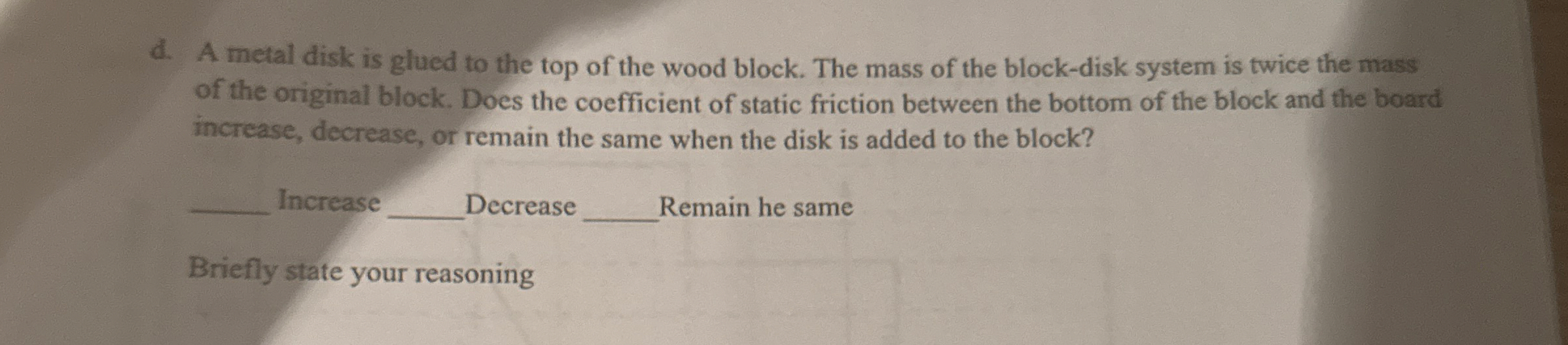 d . A metal disk is glued to the top of the wood