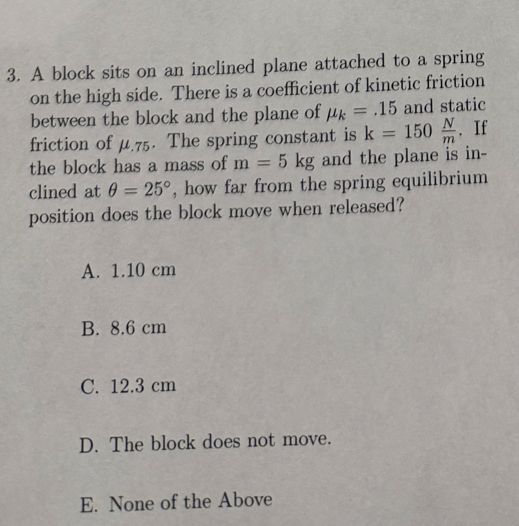 A block sits on an inclined plane attached to a