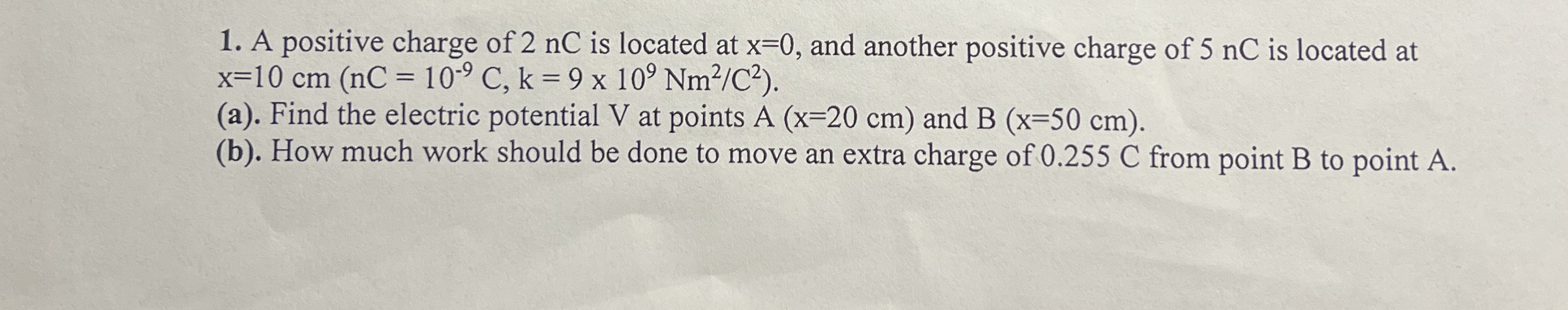 A positive charge of 2 nC is located at x = 0 ,