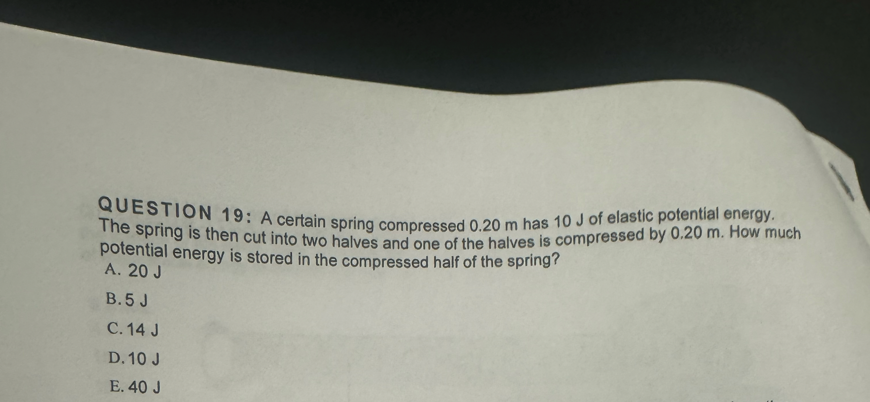 QUESTION 1 9 : A certain spring compressed 0 . 2