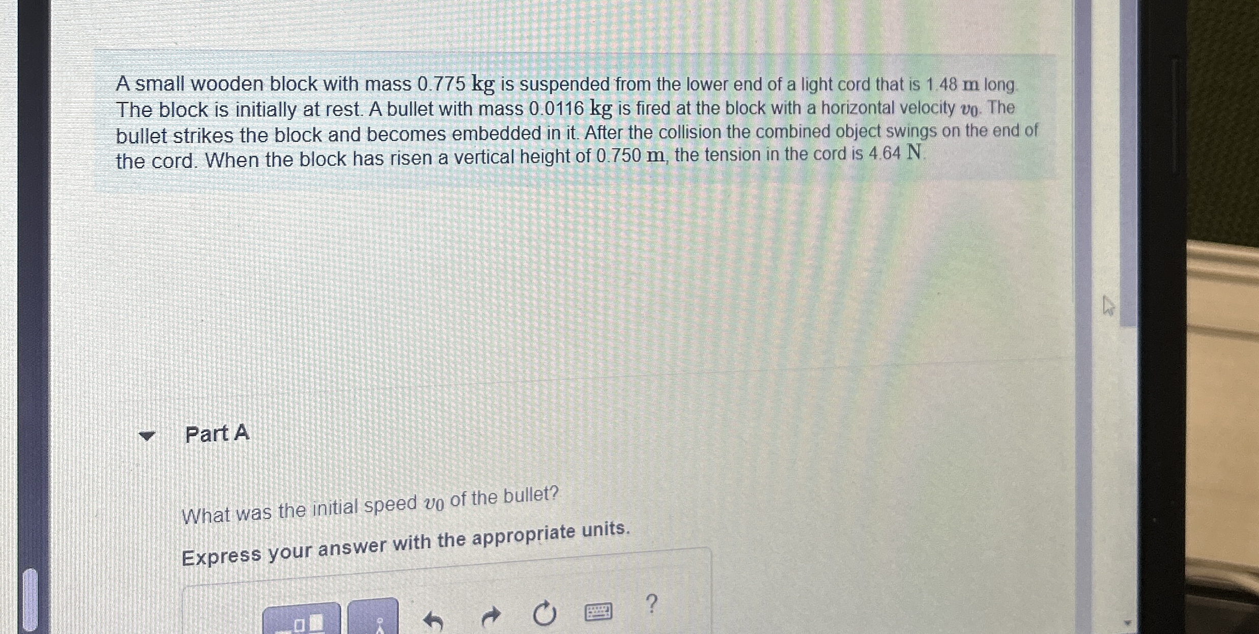 A small wooden block with mass 0 . 7 7 5 kg is