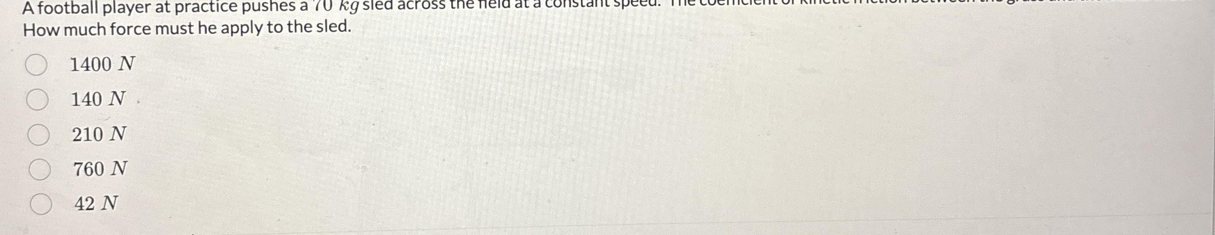 A football player at practice pushes a 7 0 kg