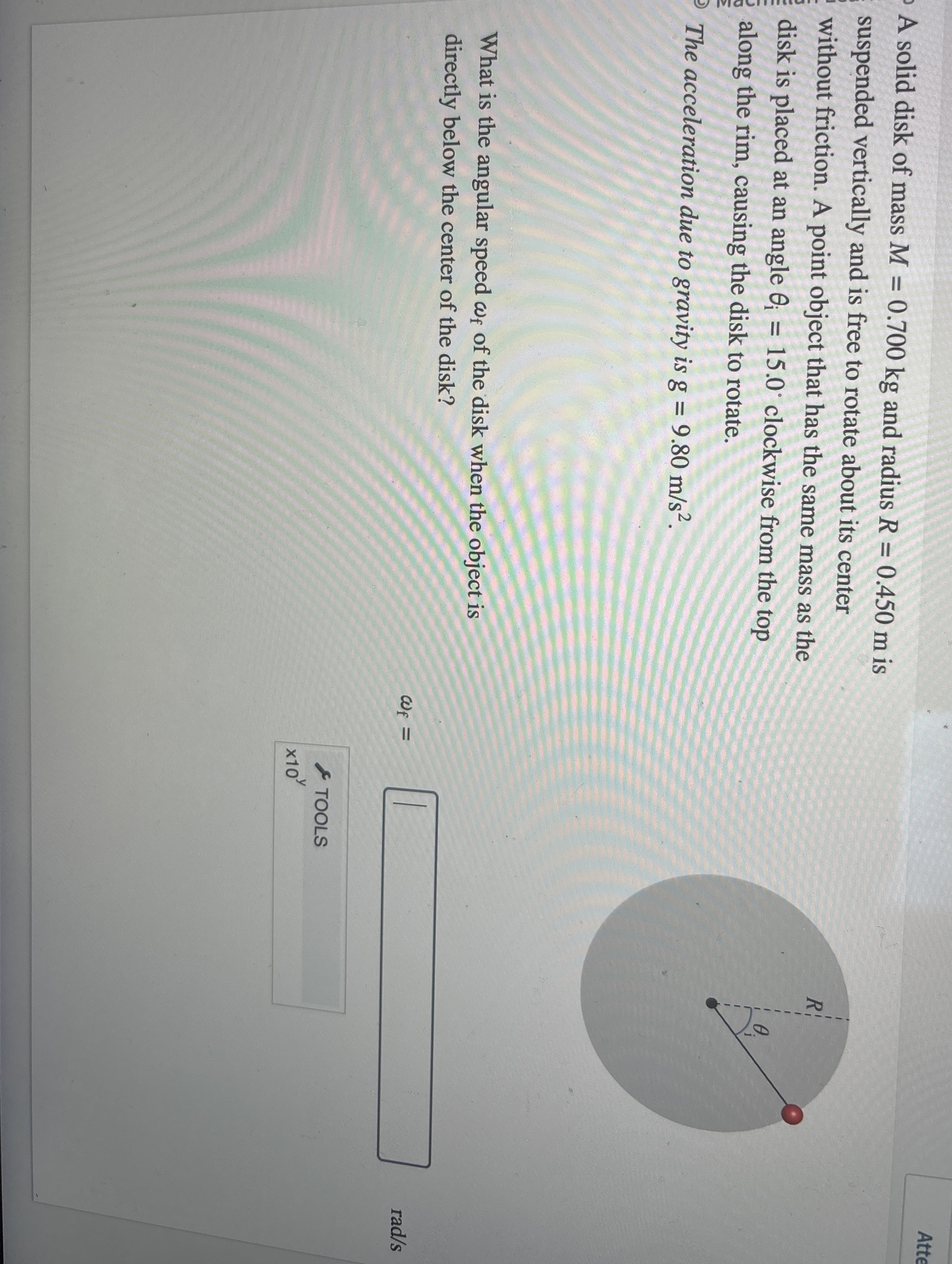 A solid disk of mass M = 0 . 7 0 0 k g and radius