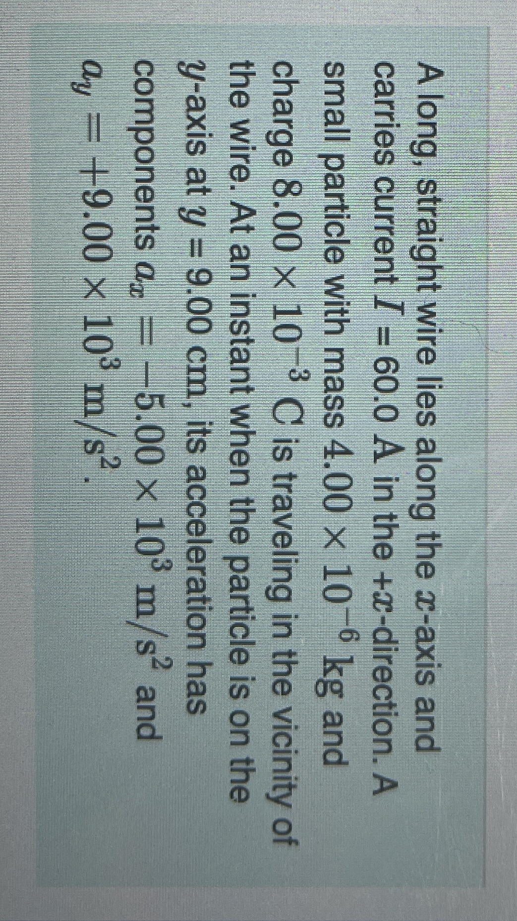 A long, straight wire lies along the x - axis and