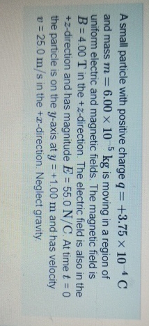A small particle with positive charge q = + 3 . 7
