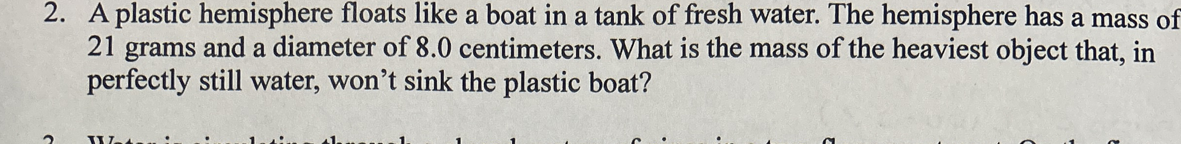A plastic hemisphere floats like a boat in a tank
